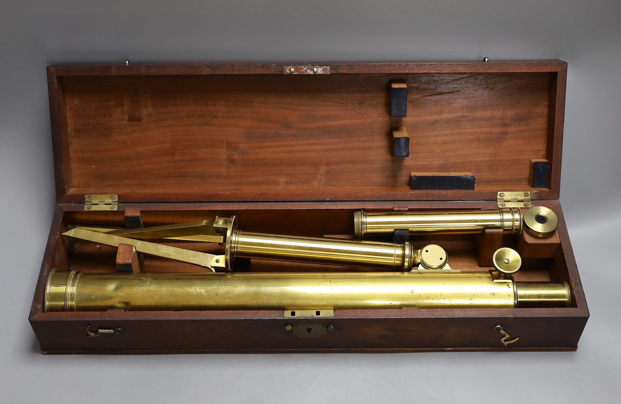 A cased set brass microscope